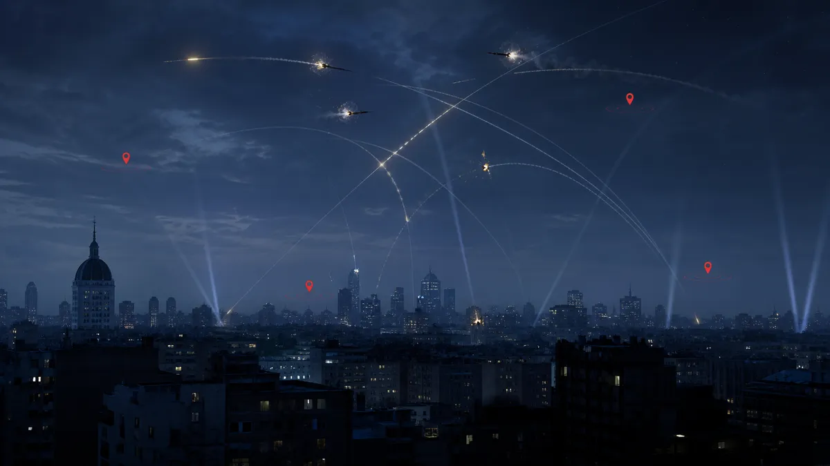 Generic editorial illustration of nighttime air defense interceptions over a city skyline