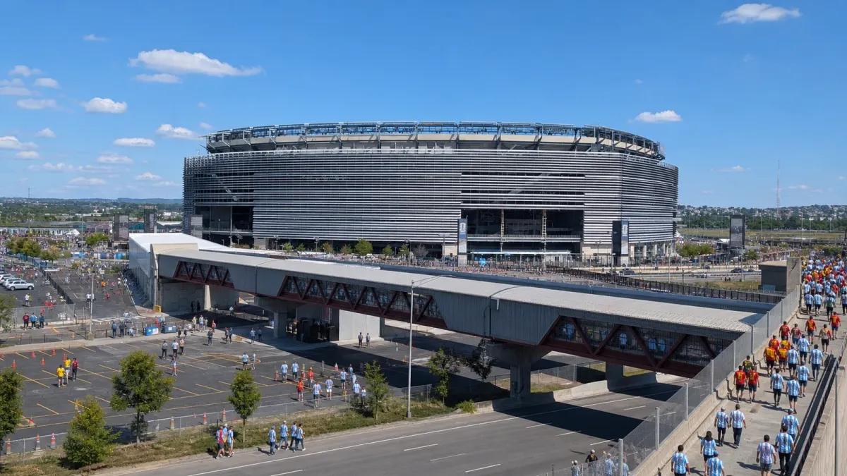 New York/New Jersey Stadium exterior with fans approaching for a major soccer final