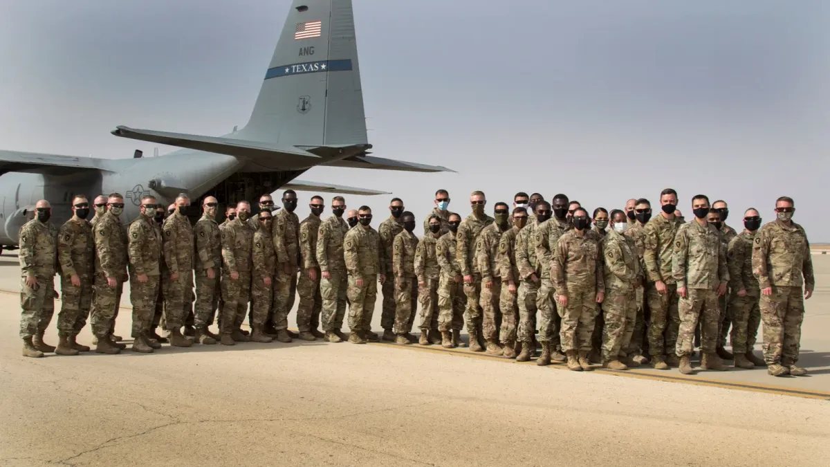 File photo of U.S. soldiers and a C-130 aircraft at King Faisal Air Base in Jordan in March 2021
