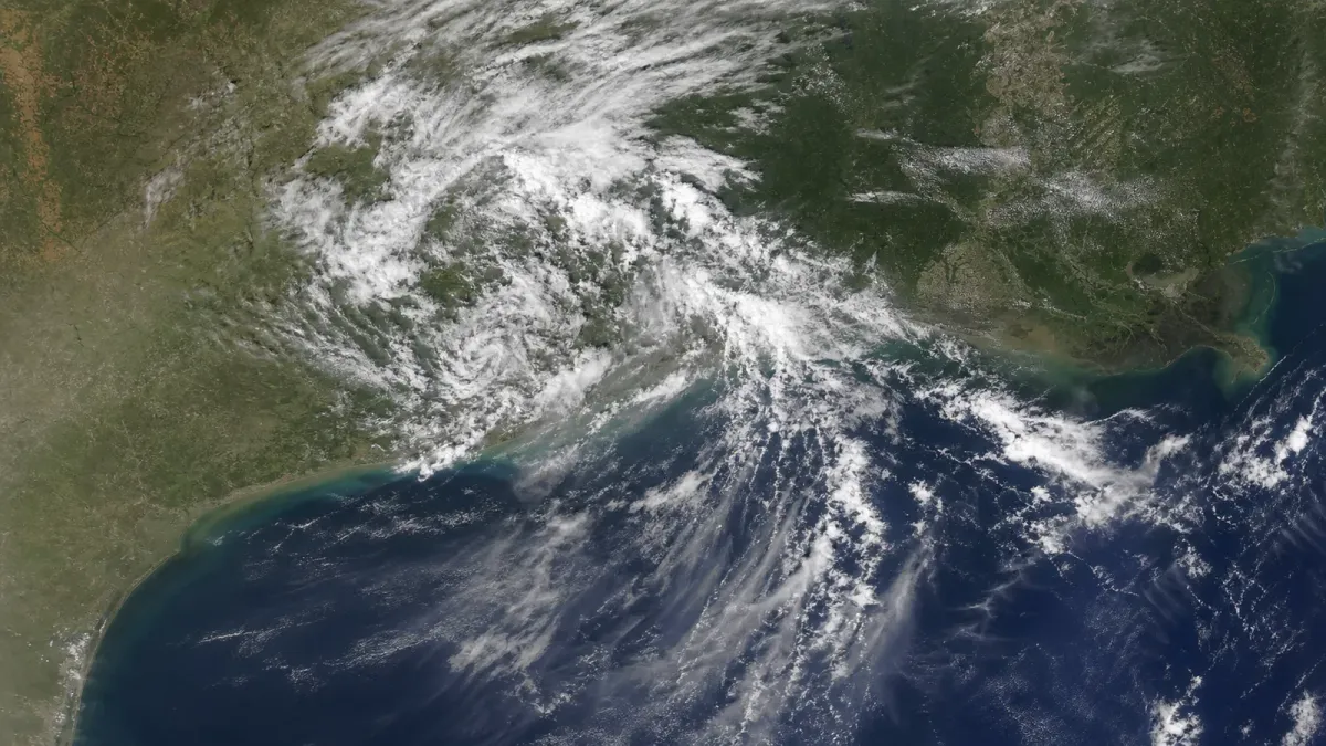 Source-grounded satellite visualization of Bertha's broken cloud bands moving inland over the upper Texas coast