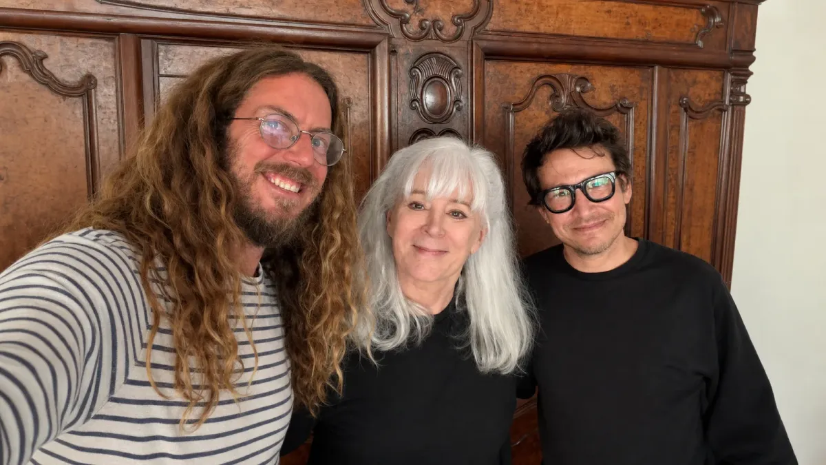 Taran Noah Smith, Patricia Richardson and Jonathan Taylor Thomas standing together in a wide editorial treatment of Richardson's reunion photo