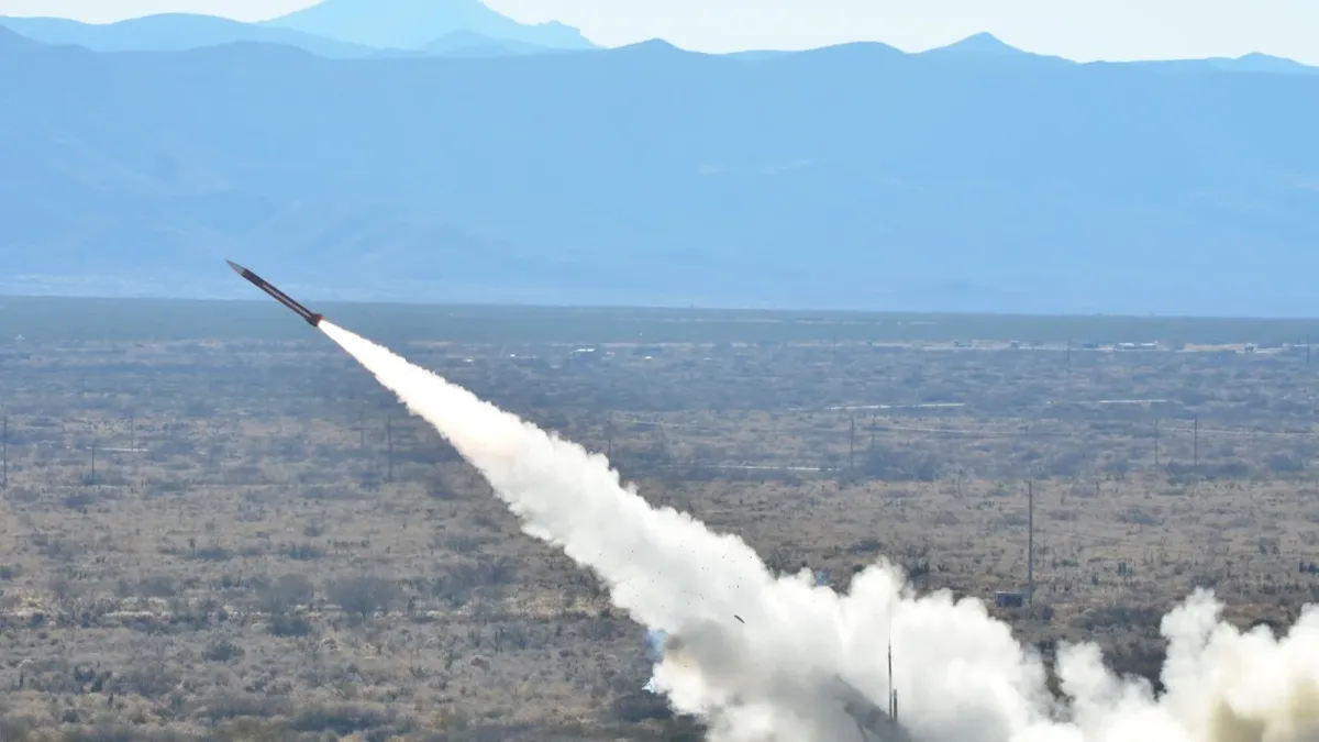 A Patriot missile launches over a desert range during an official Army training exercise.