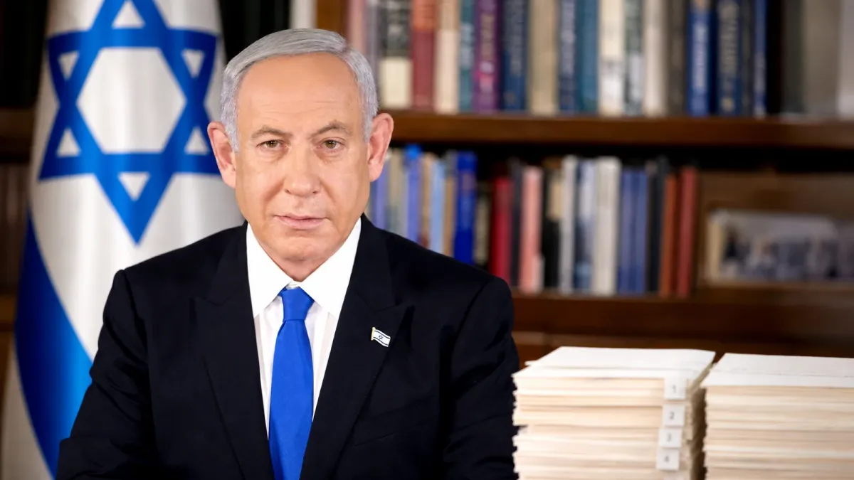 Benjamin Netanyahu in a source-grounded editorial portrait beside unreadable agreement pages split by a visible gap.
