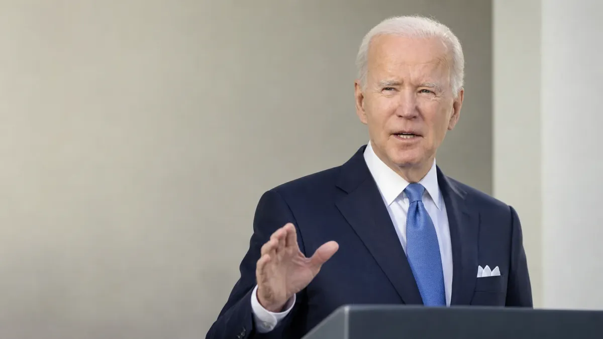 Source-grounded editorial image of Joe Biden speaking in a restrained public setting