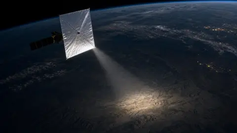 Illustration of a satellite with a reflective sail directing a narrow beam of sunlight toward the night side of Earth