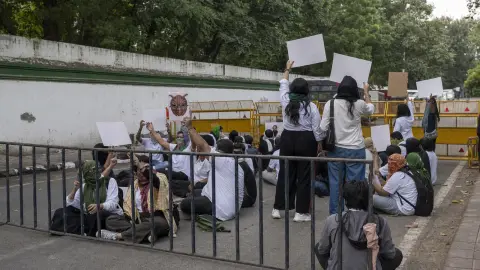 Cockroach Janta Party protesters gathered behind barricades at a transformed New Delhi sit-in scene.