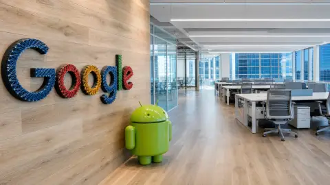 Google's recognizable Miami office wall opens into rows of unoccupied workspace in a transformed editorial view