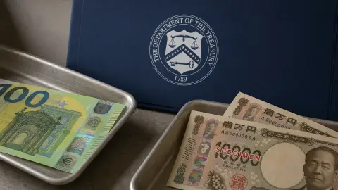 U.S. Treasury seal behind euro and Japanese yen notes arranged as a currency exchange