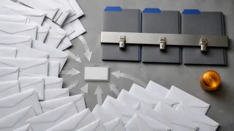 Stacks of repeated breach-notice envelopes beside three locked credit files in an editorial still life