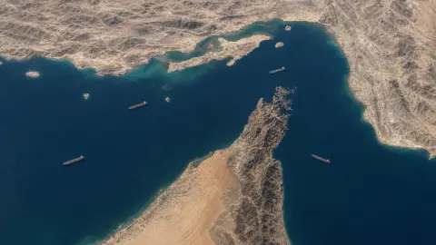 The Strait of Hormuz bottleneck between Iran and Oman with a few widely spaced tankers